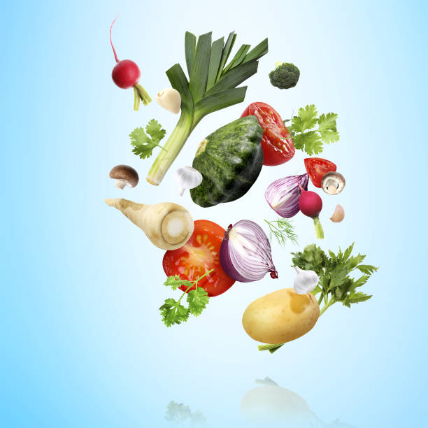 istock Many fresh vegetables, mushrooms and herbs falling on light blue background 1644779990