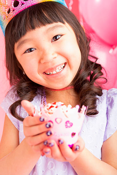 istock Young girl holding a cupcake 164478031