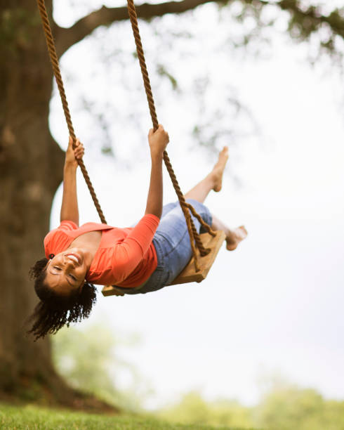 Ruined playground swing in the neighborhood, social issues concept