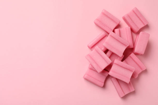 istock Tasty chewing gums on pink background, flat lay. Space for text 1644782673