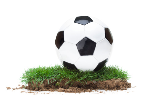 Part оf  green meadow with a soccer ball on it isolated on  white background