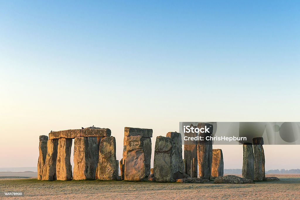 Stonehenge, Salisbury Plain, Wiltshire A wide angle view of Stonehenge in the landscape of Salisbury Plain, with the first light on a cold frosty morning. Stonehenge Stock Photo