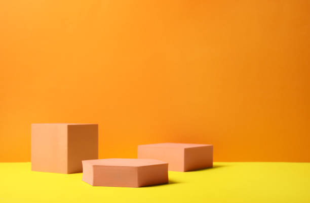 istock Geometric figures on orange background, space for text. Stylish presentation for product 1644795230