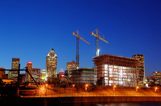 Illuminated Construction Building at Night  buzbuzzer montreal city stock pictures, royalty-free photos & images