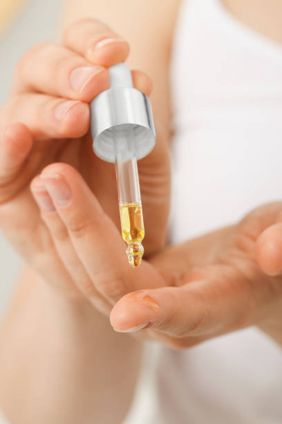 istock Woman applying essential oil onto hand, closeup 1644807611