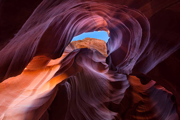 Upper Antelope Canyon A composition capturing an incredible dynamic range, from the shadows to the bright sky, Upper Antelope Canyon, Page, Arizona. upper antelope canyon stock pictures, royalty-free photos & images