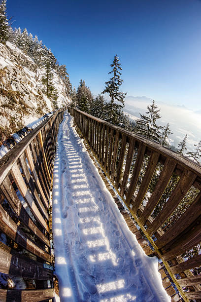 Mountainside Walkway in the Alps Narrow walkway along a cliff on a mountain in the Alps. gaisberg stock pictures, royalty-free photos & images