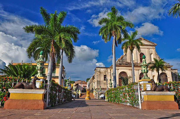 A beautiful view of Trinidad de Cuba Trinidad is a town in Cuba. 500-year-old city with Spanish colonial architecture is UNESCO World Heritage site. Trinidad is famous for its lovely, cobblestone streets, pastel coloured houses with elaborate wrought-iron grills. trinidad culture stock pictures, royalty-free photos & images