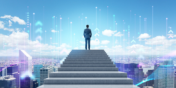 Rear view of young businessman standing on top of staircase and looking at city skyline with double exposure of network interface and arrows pointing up. Concept of smart city and internet of things