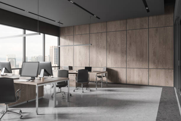 istock Stylish workspace interior with pc desktop in row, armchairs and panoramic window 1644845000