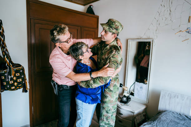 istock Soldier embracing parents at home 1644853996