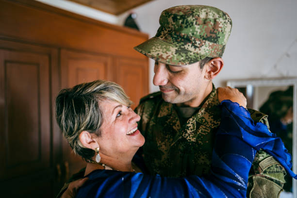 istock Soldier embracing his mother at home 1644854009
