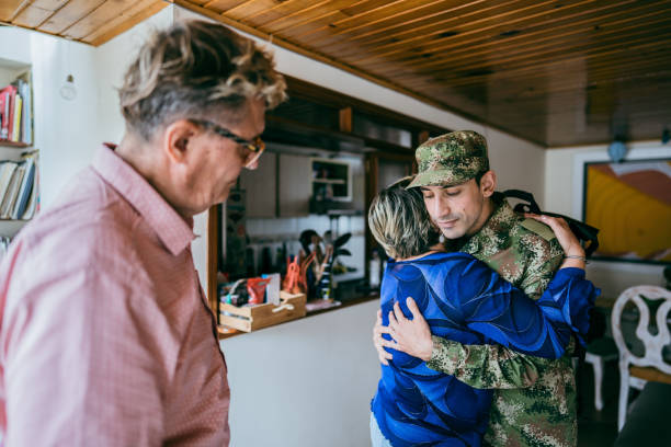 istock Soldier embracing his mother after his return home 1644854524