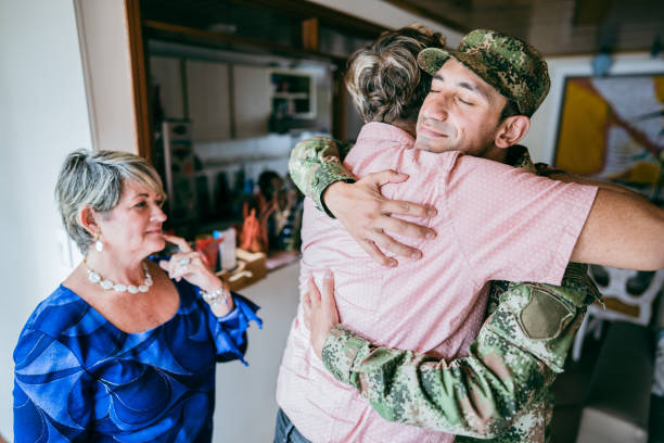 istock Soldier embracing his father after his return home 1644854528