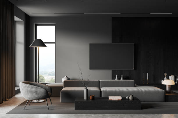 istock Grey living room interior with couch and tv screen, decor and panoramic window 1644863294