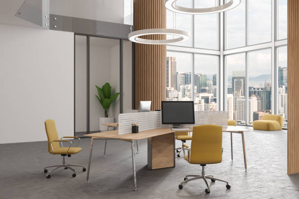 istock Stylish coworking room interior with pc computer, relax corner and window 1644863315