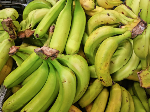 Yellow bananas on the shelves of a grocery supermarket