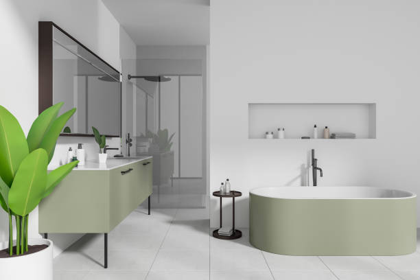 istock White hotel bathroom interior with bathtub, sink and douche with accessories 1644870488