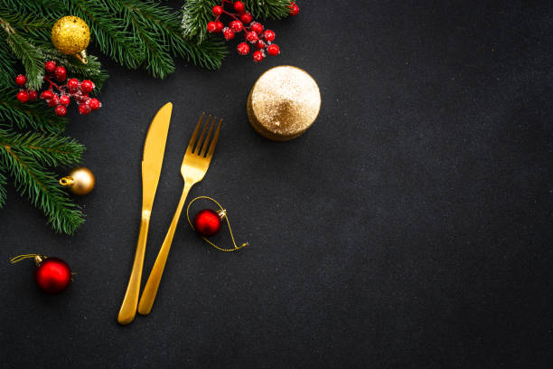 istock Christmas table setting with plate, cutlery and christmas decorations on white background. 1644870663