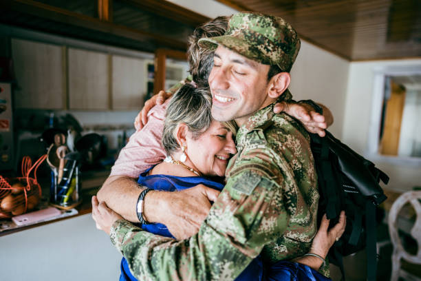 Soldier embracing his parents after returning home