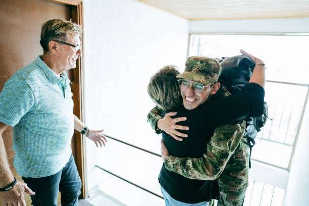 istock Soldier son embracing his mother after his return home 1644872631