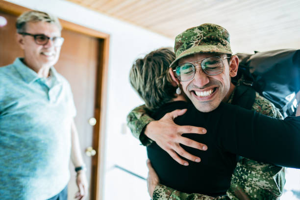 istock Soldier son embracing his mother after his return home 1644872635