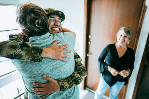 istock Soldier embracing his father after his return home 1644872641