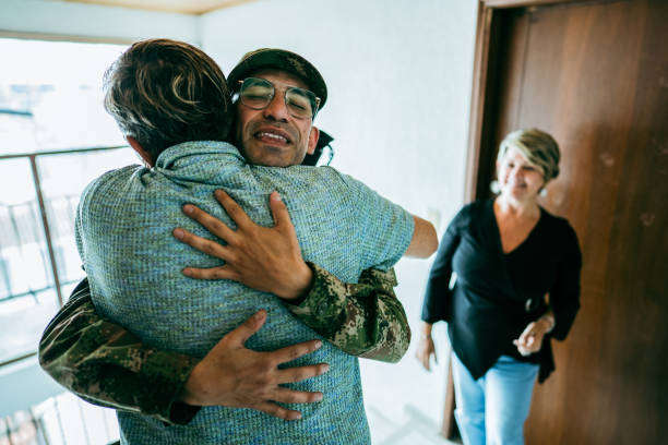 istock Soldier embracing his father after his return home 1644872652