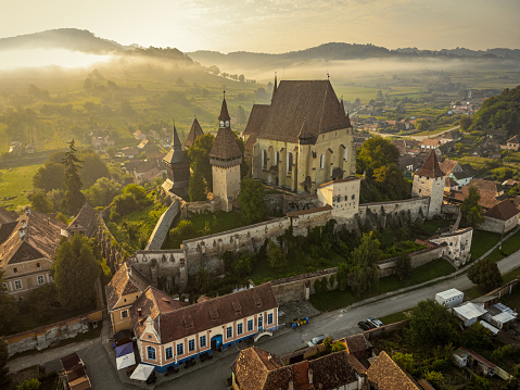 The medieval Saxon village of Biertan and its fortified church during a dreamy morning. Photo taken on 17th of August 2023 in Biertan, Sibiu County, Romania.