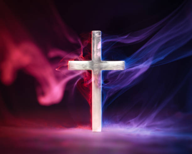 istock Religious cross emanating red and blue smoke symbolizing Heaven and Hell, good and evil, right and wrong, or other metaphor for moral choices. 1644913683