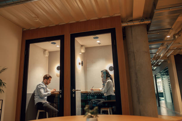 istock Two diverse business people working in modern coworking space 1644973372