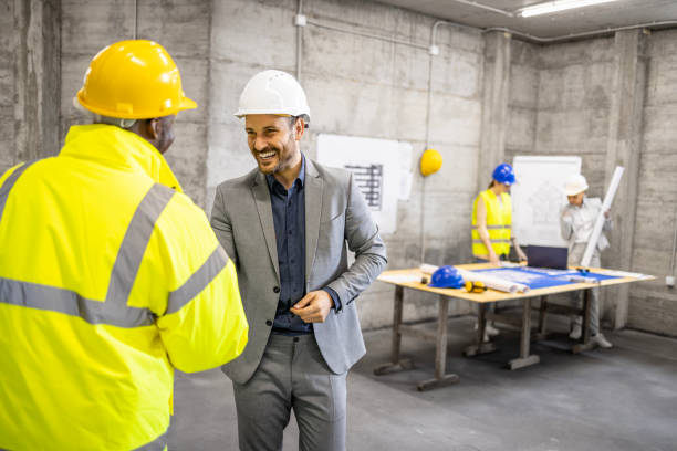 istock Construction engineer shaking hands and welcoming new worker to the team. 1644977107