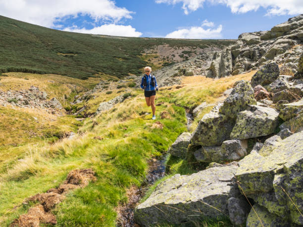 istock Woman practicing sport in the mountains 1644981076
