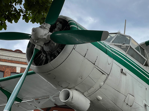 Propeller biplane aircraft type SP-ZEN - PZL-Mielec An-2 standing on the square in front of the Aviation Center of the State Academy of Applied Sciences in Chem, Poland.