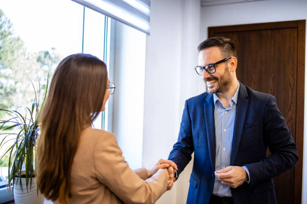 istock Business people shaking hands in the office. 1644986413