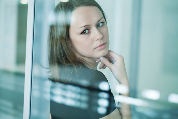 istock sad woman at the window 164498746