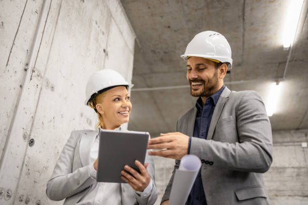 istock Civil engineer and architect visiting construction site and discussing about new project plan on tablet computer. 1644990057