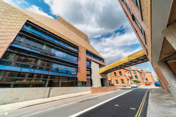 Dramatic modern architecture,center of further education and reading,for the public and university of Worcester students alike,a distinctive golden tiled city landmark,with large glass windows.