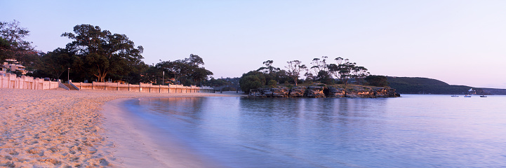 Wide angle panoramic view of Balmoral Beach in Sydney in the pre dawn morning light.