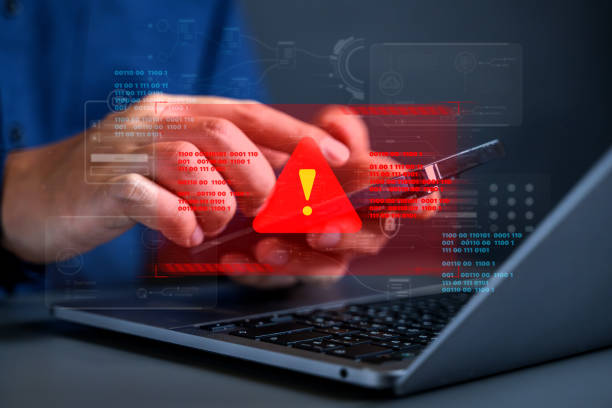 istock People with warning notification and spam message icon on laptop. 1645016388