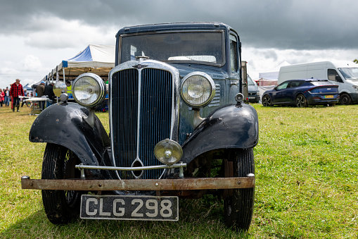 Pembrokeshire, United Kingdom - September 10, 2023: Morris Minor car - known as the 'Moggie' and built in England from 1948 until 1972, photographed at a rally at Scolton Manor, Pembrokeshire, Wales, to celebrate the 75th Anniversary of the marque.