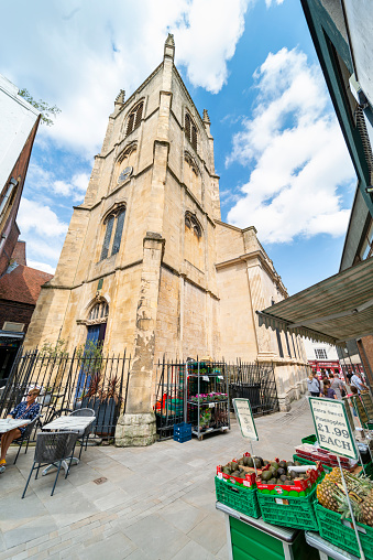 Worcester,Worcestershire,UK-August 17 2023:The eastern end and bell tower of the historic 17th Century Anglican building,a narrow street connects pedestrians to the main high street of Worcester.