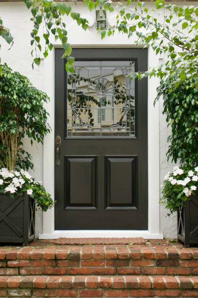 istock Traditional white cottage with black Dutch door 1645107076