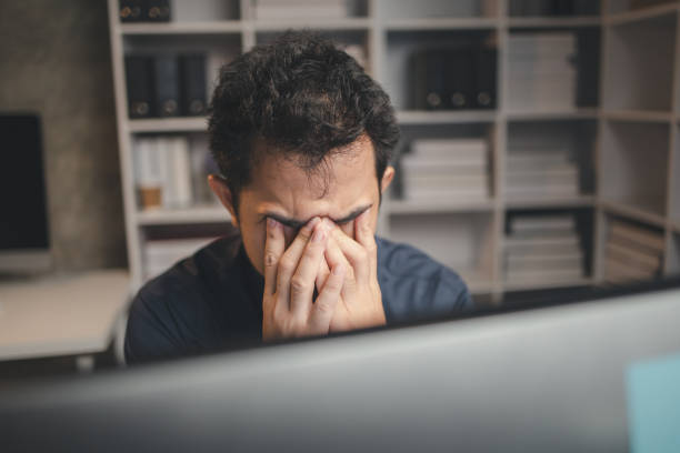 istock Startup company employees work overtime and work hard causing stress and fatigue from work, office syndrome, exhausting work makes the body tired. Overtime concept and office syndrome. 1645161069