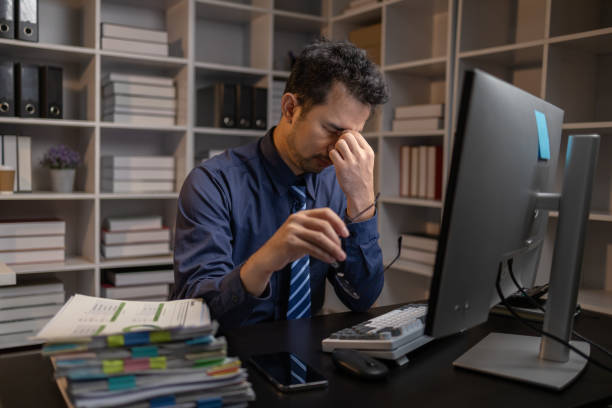 istock Startup company employees work overtime and work hard causing stress and fatigue from work, office syndrome, exhausting work makes the body tired. Overtime concept and office syndrome. 1645164768