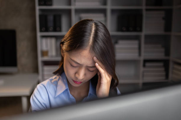 istock Company employees working overtime after work, working overtime after working hours due to heavy workload, employees are stressed and tired from working hard all day and continuously working overtime. 1645168401
