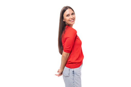portrait of emotional cute young european brunette lady in red t-shirt on white background with copy space.
