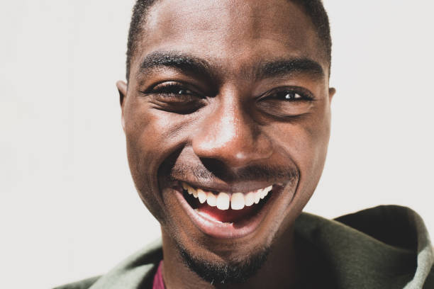 istock Close up laughing african American man by white background 1645231940