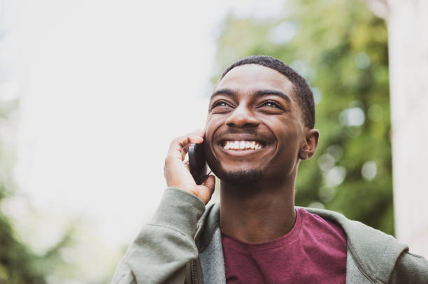 istock Close up cool young black man talking with cellphone 1645233003