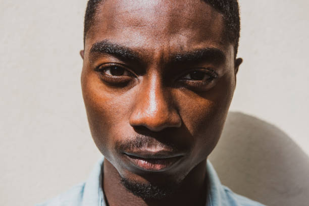 istock Close up tough young African American man staring 1645234698